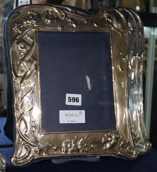 A set of three 1980s Art Nouveau style silver mounted photograph frames, 12.5in.